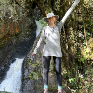Clara Smartt with a waterfall