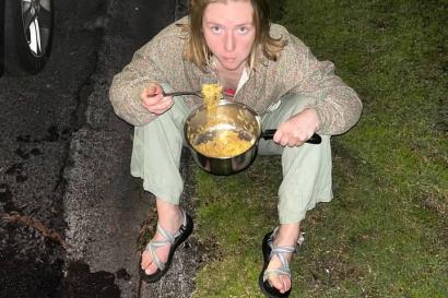 Eating noodles on the curb