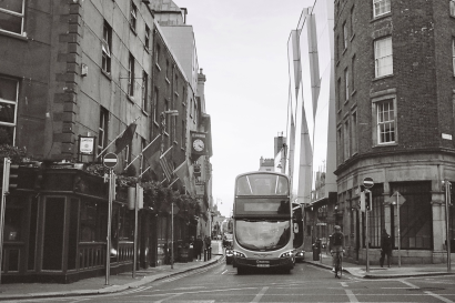 Streets of dublin, unoccupied except for a bus and a bike