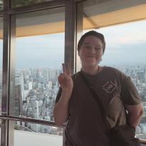 Author, Macks, standing in front of the view from the top of Tokyo Tower.