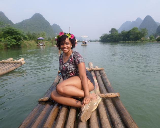 a student floating on the river on a raft in Guangzhou