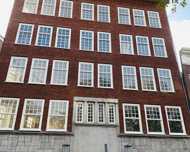 Exterior view of the Amsterdam Center, a brick building