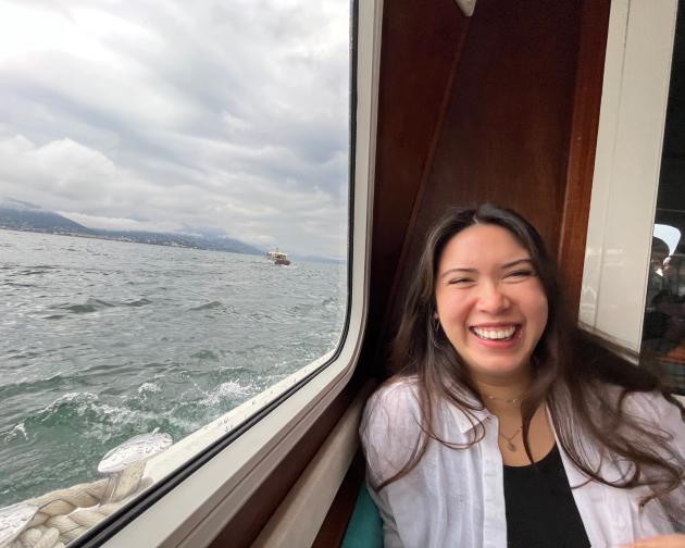 a student on a boat in Lake Maggiore laughing
