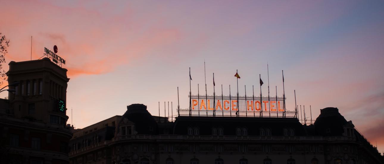 The sign for the Palace Hotel in Madrid, Spain at sunset