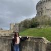 Danai standing in front of a view of one of Windsor Castle’s towers