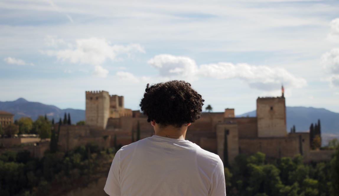 A student looks out of Granada, Spain.