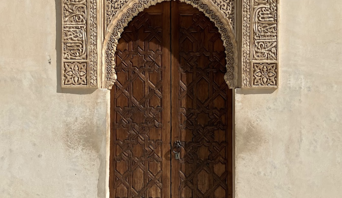 Carved wooden door with ornate lintel