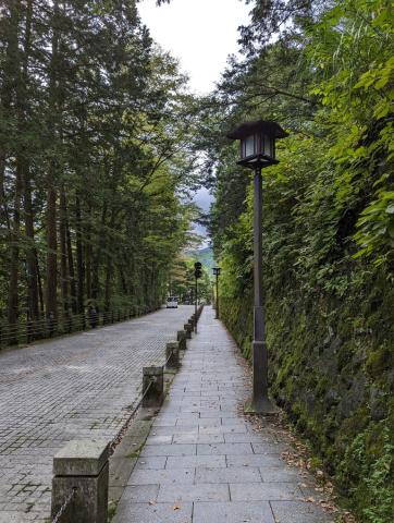 another street in nikko with a lamp post