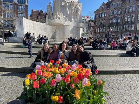 My friends and I sitting above tulips in Amsterdam