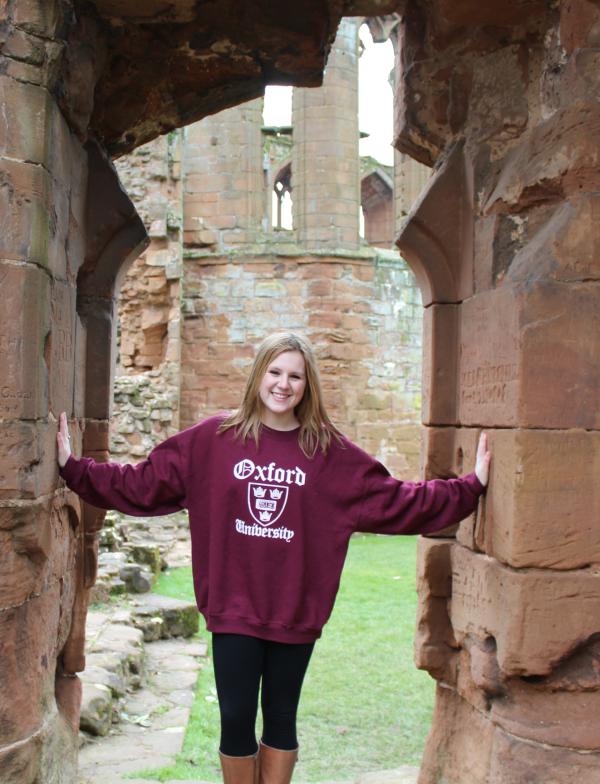 A student poses in the doorway of Stratford castle