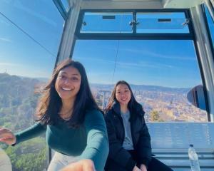 two students pictured in sky lift 