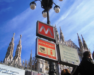Milan metro sign with blue sky in background