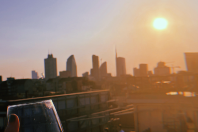 milan skyline and wine glass