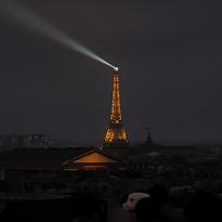 The Eiffel Tower lit up from the top of the Galerie de Lafayette.