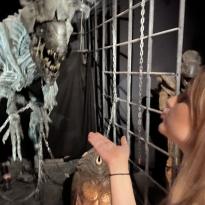 Hailey blowing a kiss towards an original sculpture from the movie Alien vs. Sculpture at the Musėe Cinėma et Miniature