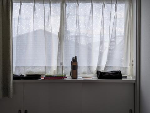 Some of the things I brought with me (books, water bottle, toiletries) on a windowsill