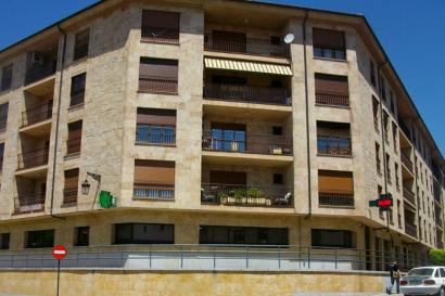 The exterior of the tan stone IES Abroad Salamanca Center. The multi-story building has balconies on each floor. 