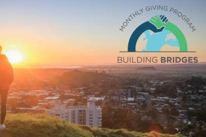 An image saying "Monthly giving program Building Bridges"
