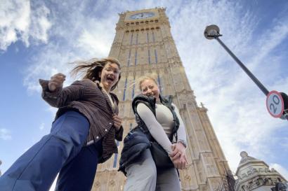 Two students smile in front of Big Ben.