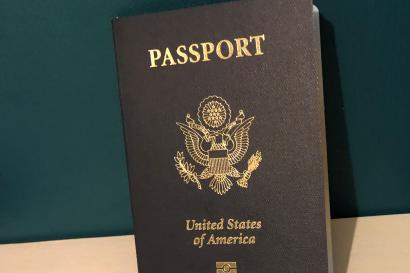 A picture of a a passport against a green background 
