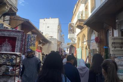 Students walking through a crowded Moroccan Street