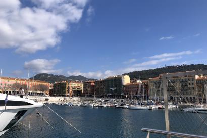 A picture of the port in Nice with boats and buildings in the background