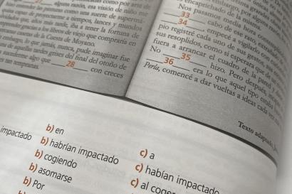Picture of textbook page with reading passage and multiple choice questions on grammar usage. 