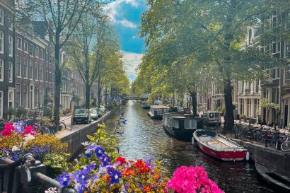 Colorful flowers on a bridge over an Amsterdam canal