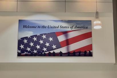 Welcome back to USA airport sign