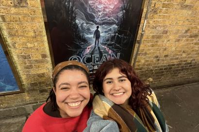 Paulina and Queenie pictured in front of the production's poster.