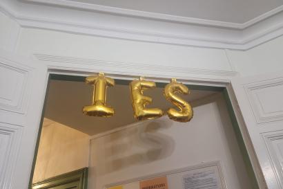 A doorway with taped letter balloons spelling IES