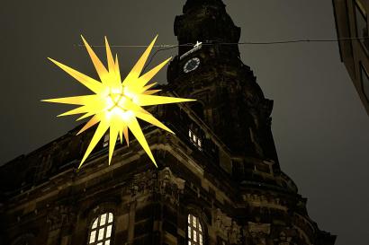 Star-shaped lantern hangs in front of church