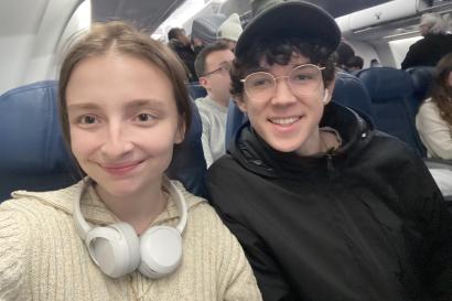 A picture of me and my partner Hayes in our seats on our flight to London.