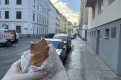 This is a croissant that I was holding up to the middle of the pretty street in Vienna where I bought it.