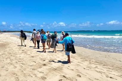 IES students walking on the beach