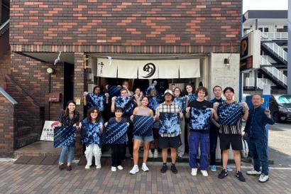 Students posing with their artwork in Tokyo