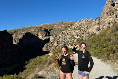 My friend Molly and I stand side by side during our hike, pretending to be tigers by making faces and making claws with our hands.