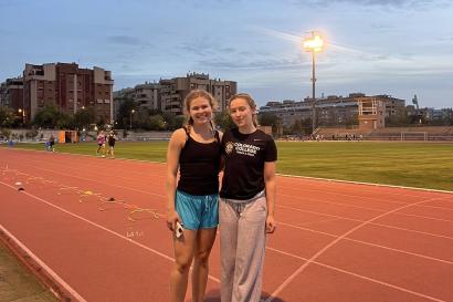 My friend Kensi and I at the track after running wickets, smiling for the camera at sunset