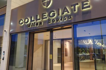 The entrance of Collegiate Milan Bovisa with keycard access doors and a reception area.