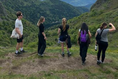 5 people face the backdrop of Vosges mountains