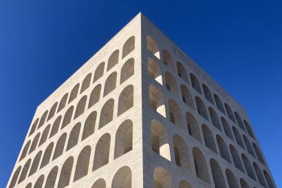 A big stone building with blue sky behind it