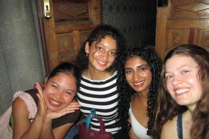 Some friends and I sitting on the steps outside my residence hall.
