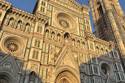 A photo of a building with many designs, including geometric designs and paintings.