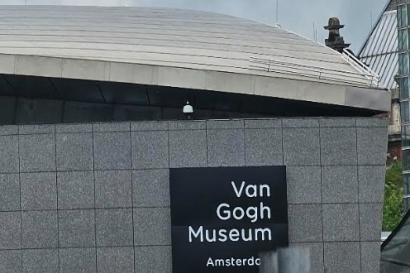 This is a far away snapshot of the sign labeled "Van Gogh Museum Amsterdam"