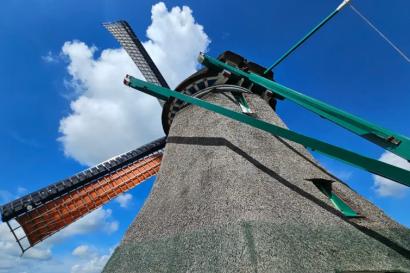 An upward capture of a Zaanse Schans windmill from its base. 
