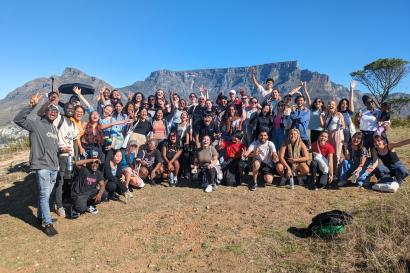 Denisse Luz Ramos Guzman smiling with friends while living in Cape Town, South Africa.