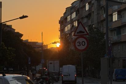 The sun setting in the Nou Barris neighborhood in Barcelona, Spain.