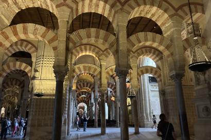 Rows of red and white arches in the Mosque Cathedral of Cordoba
