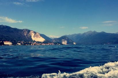 Scenic view of a lake with mountains in the background under a clear blue sky. This alt text was added with Al; accuracy may vary.