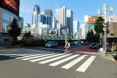 1. Person jumps in park; autumn leaves, concrete structure nearby.
2. Silhouette of dancer on urban deck at dusk.
3. Busy city street, crosswalk, tall buildings, sunny day. This alt text was added with Al; accuracy may vary.